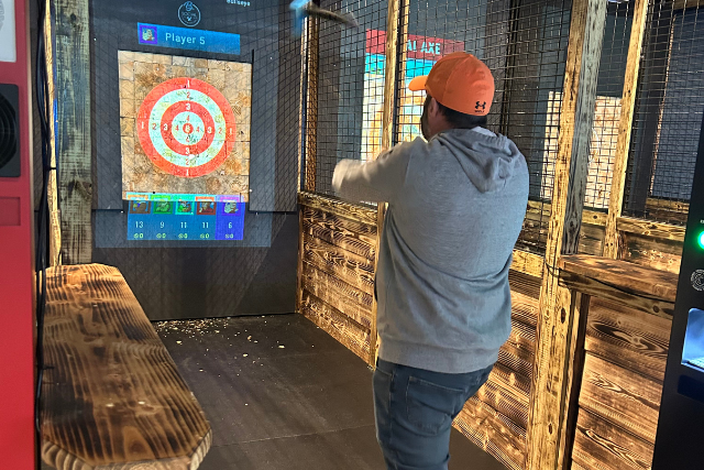 Andrew throwing an ax at the ax throwing get together